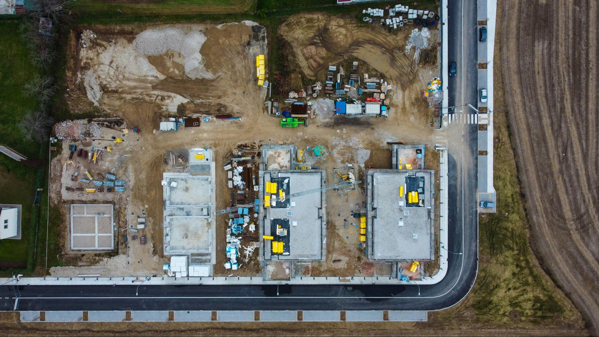 Drone capturing data over a construction site